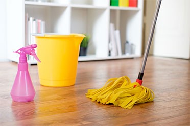 cleaning a floor by a wet mop by cleaning services in Mount Prospect
